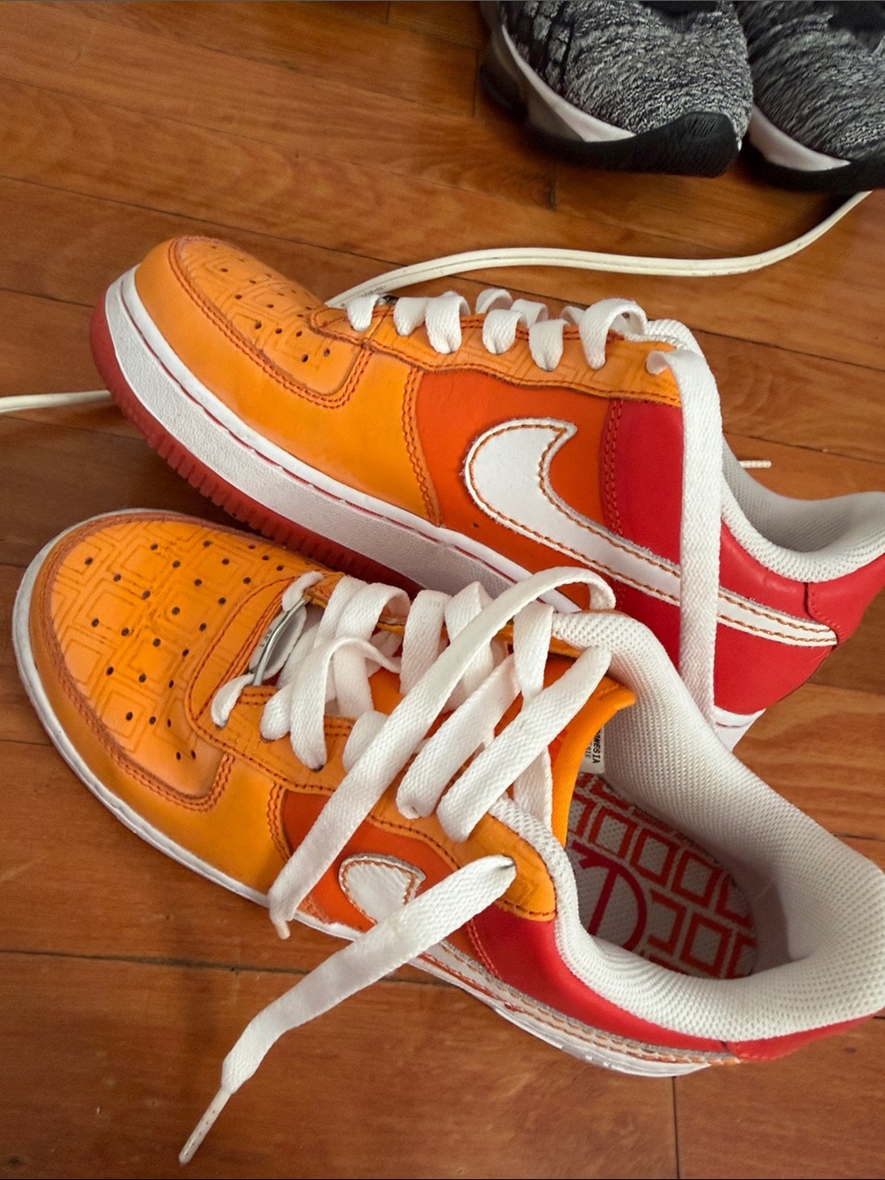 Nike Kids Orange and Red Low-Top Sneakers with White Swoosh